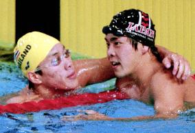 Thai, Japanese swimmers pat on each other